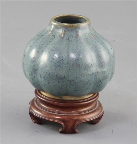 A Chinese Jun-type lobed ovoid vase, 17th/18th century, height 6cm, wood stand